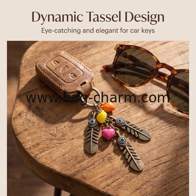 GUGEER Blue Evil Eye Keychain,Heart Feathers Keychain Turco Amuleto de Cristal Hecho a mano Cuaderno de colgantes Ornamento de joyas Amuleto de buena suerte